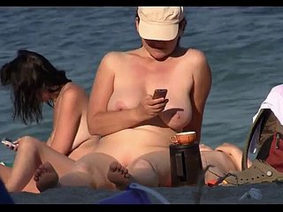 Impertinent nudist babes sunbathing superior to before burnish apply beach superior to before eavesdrop cam